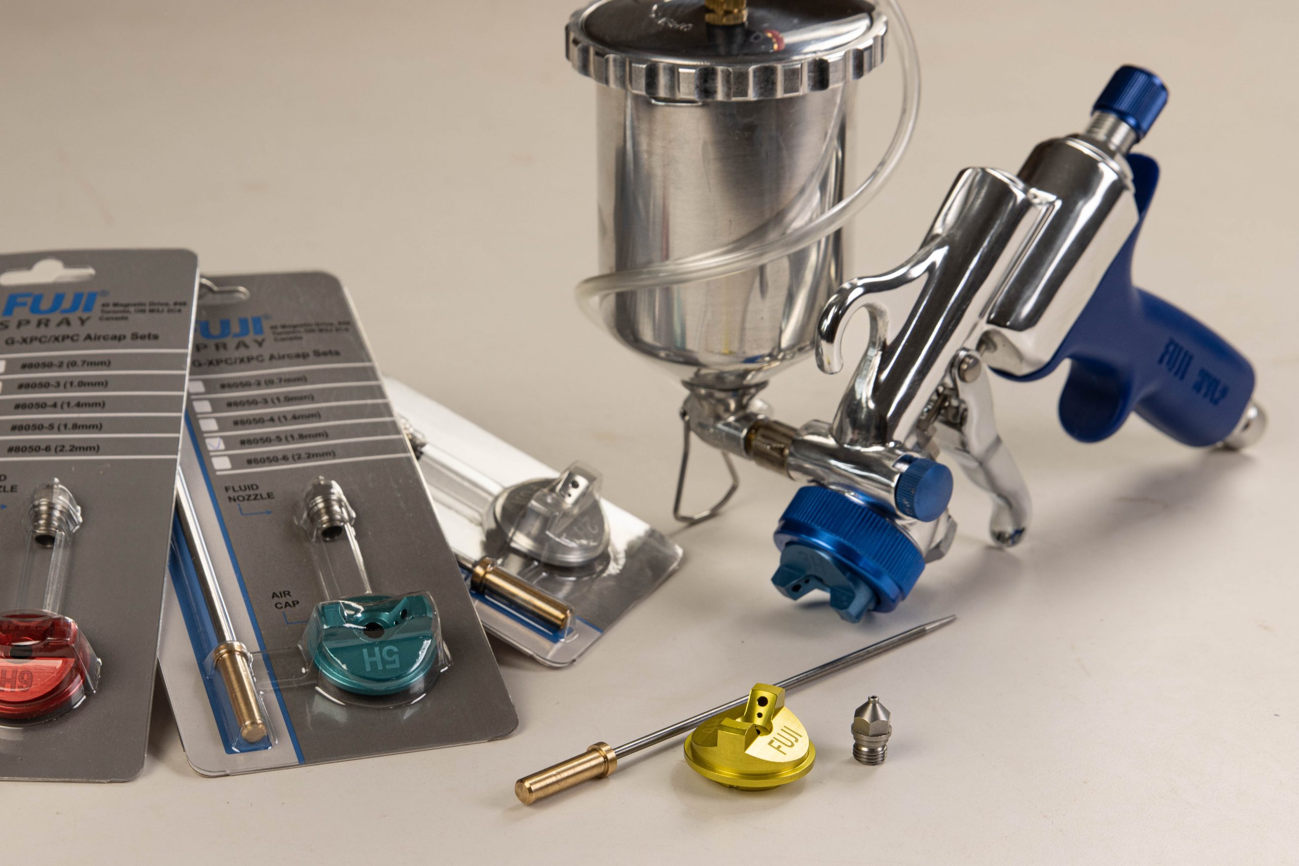 M-Model Gravity Feed Spray Gun with different air cap sets